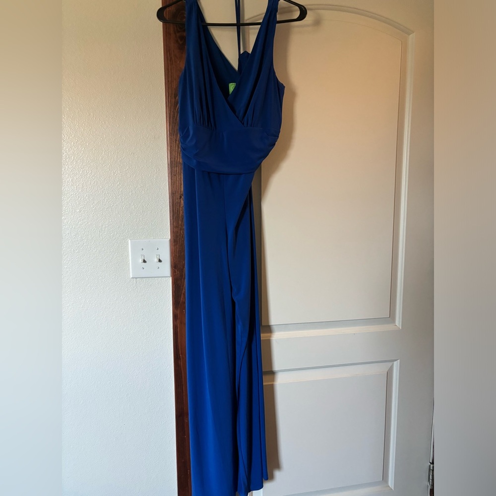 Royal blue pant romper with pockets.